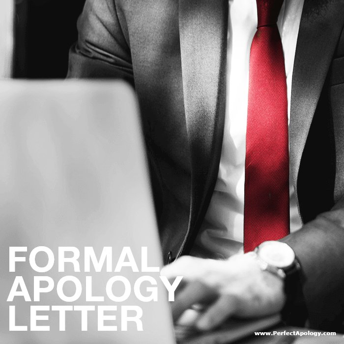 Formal Apology Letter man in a suit and red tie typing on his computer