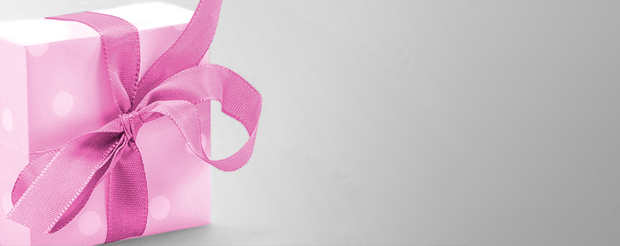 Apology gift for Her, Girlfriends and wives Present wrapped in pink and white polkadot paper with a pink ribbon